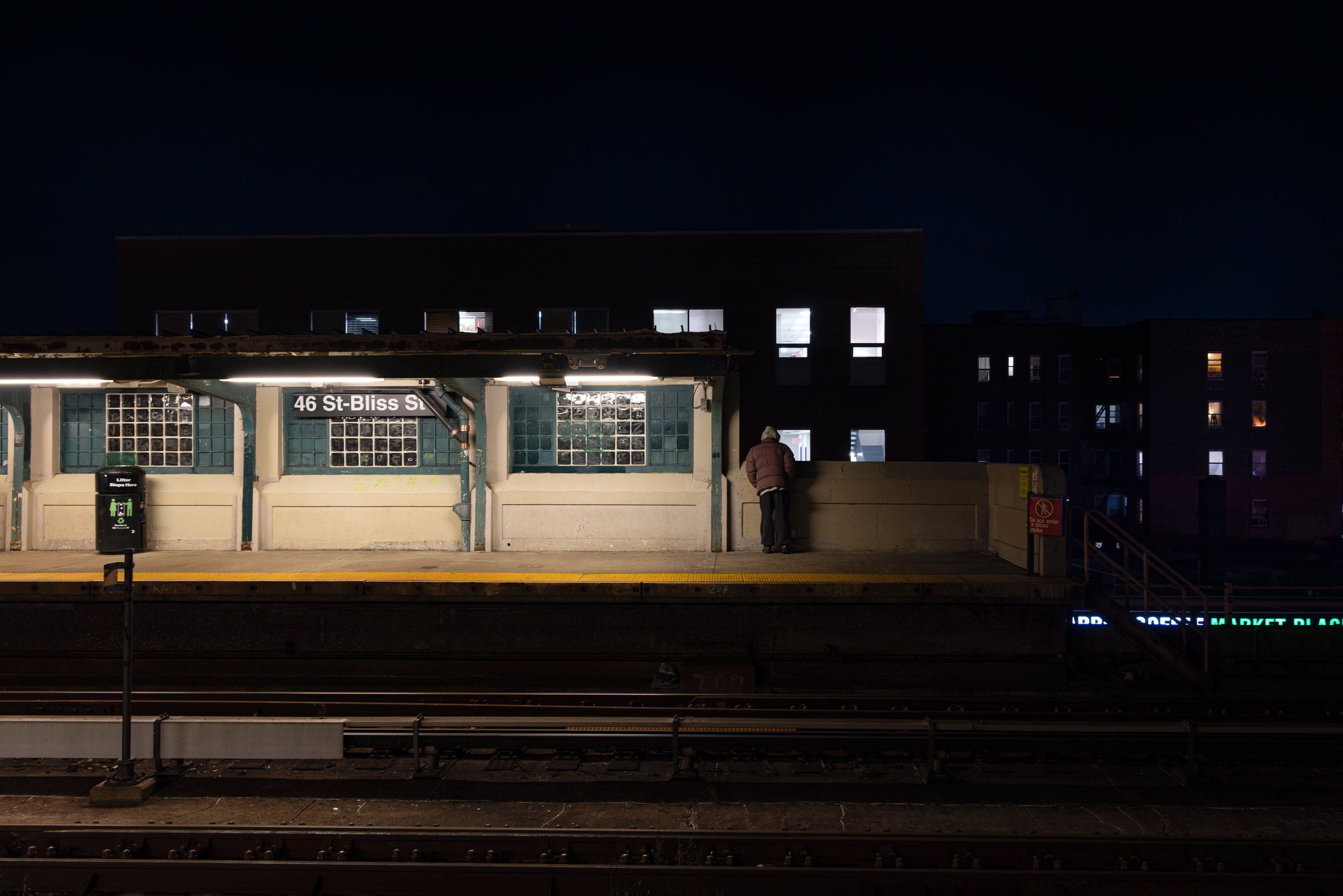 An elevated subway station at night — Win or Lose
