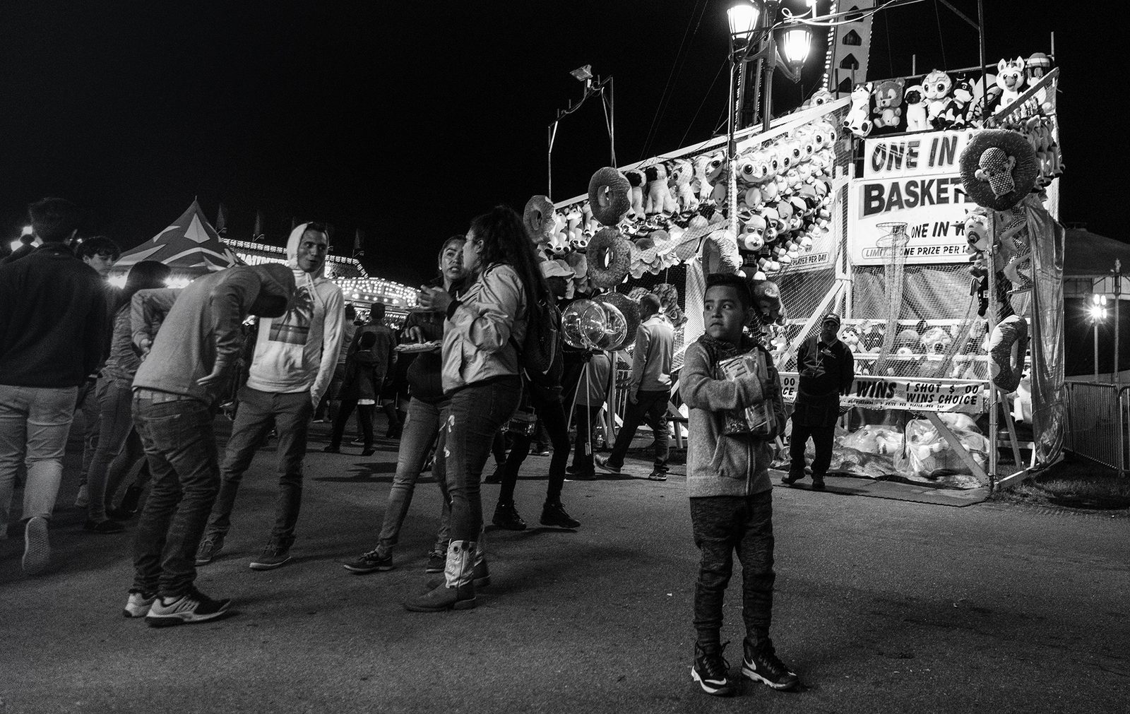 Black-and-white night scene, a crowd gathered at a fairground — Chapel Hill
