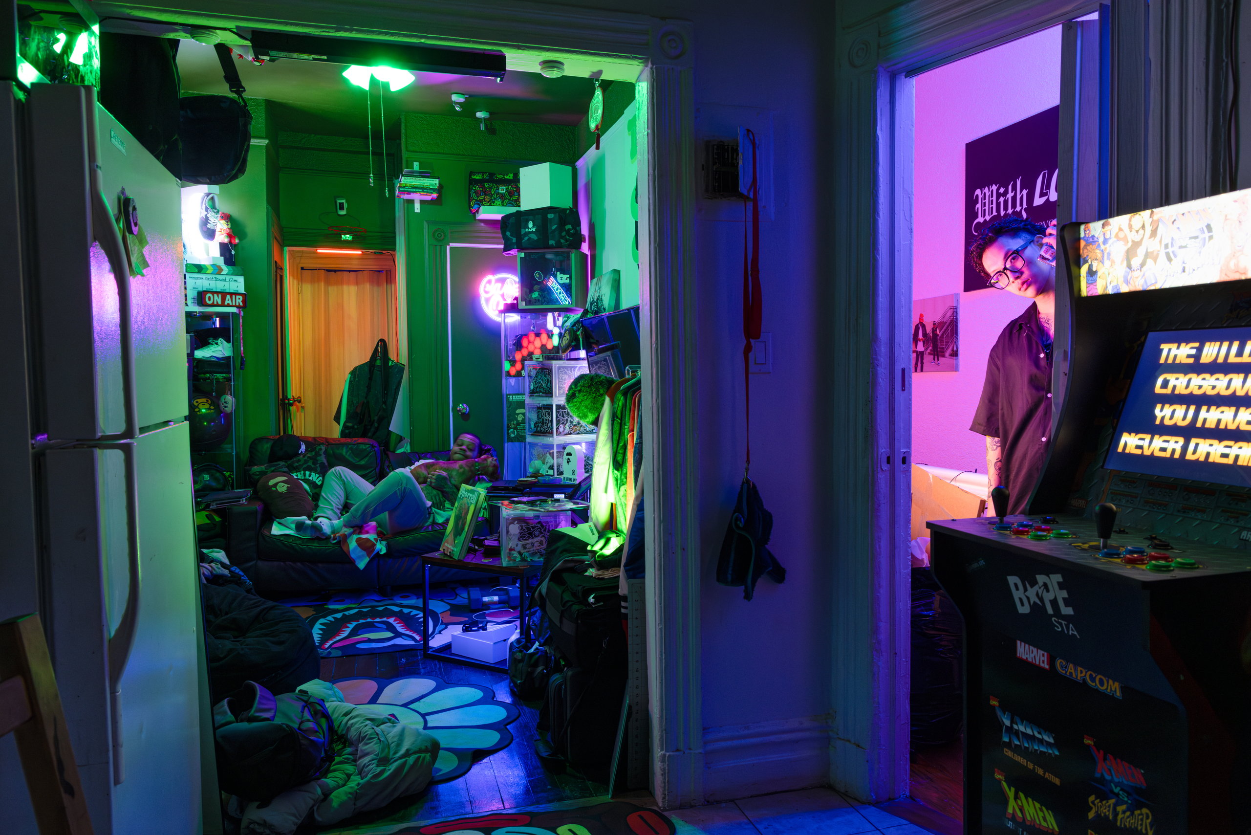A cluttered room washed in neon green and purple light — Win or Lose